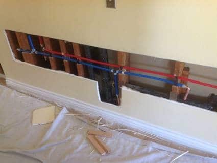 Hot and cold water supply lines being replaced throughout an Albuquerque home.