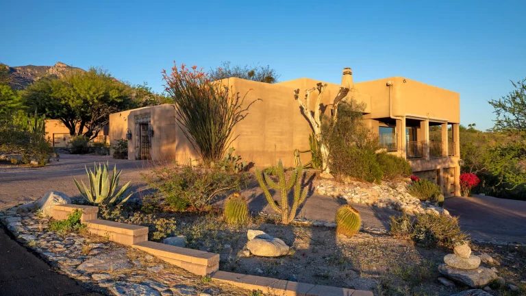 An adobe style home in the southwest USA at sunset