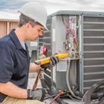 An HVAC technician testing out the HVAC condenser system