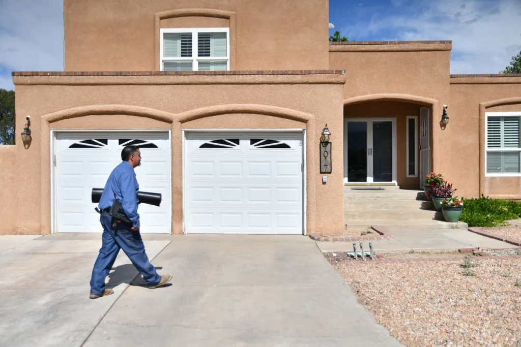 Professional HVAC technician at residential home in Albuquerque, NM
