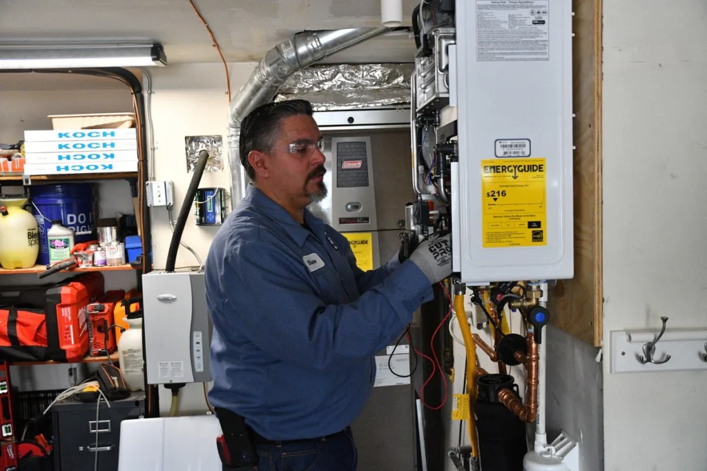 HVAC technician installing a new water heater in Albuquerque, NM