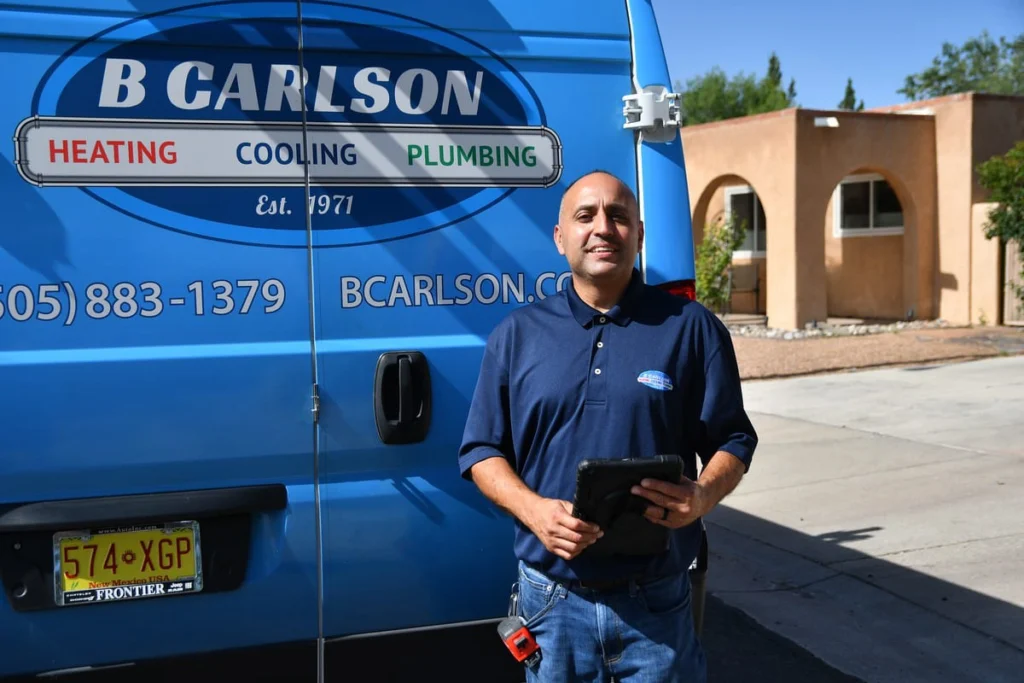 Professional HVAC technician with service van in Albuquerque, NM