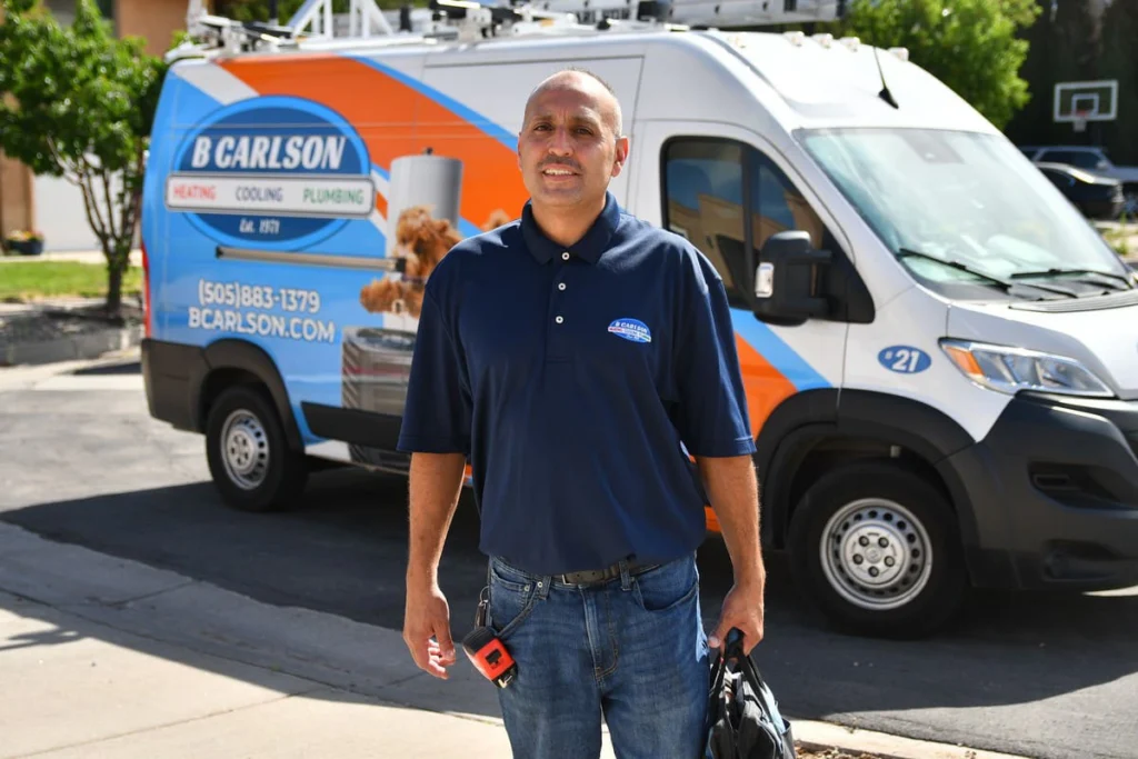 Professional HVAC technician with service vans in Albuquerque, NM