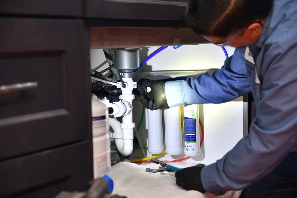 Professional installing water filtration system in Albuquerque, NM
