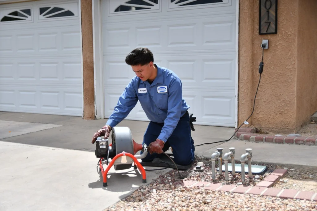 B. Carlson plumber clearing a blocked residential sewer line in Albuquerque, NM
