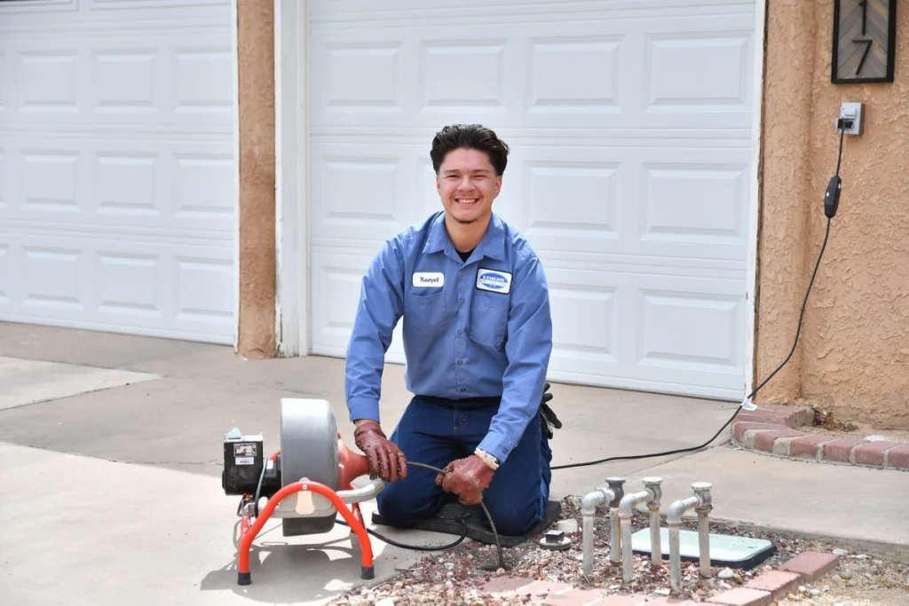 Professional plumber with drain cleaning equipment in Albuquerque, NM