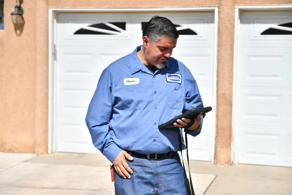 Professional technician reviewing service report in Albuquerque, NM
