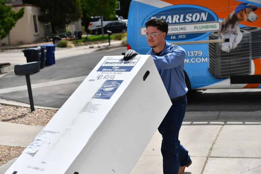 Professional technician unloading water heater in Albuquerque, NM