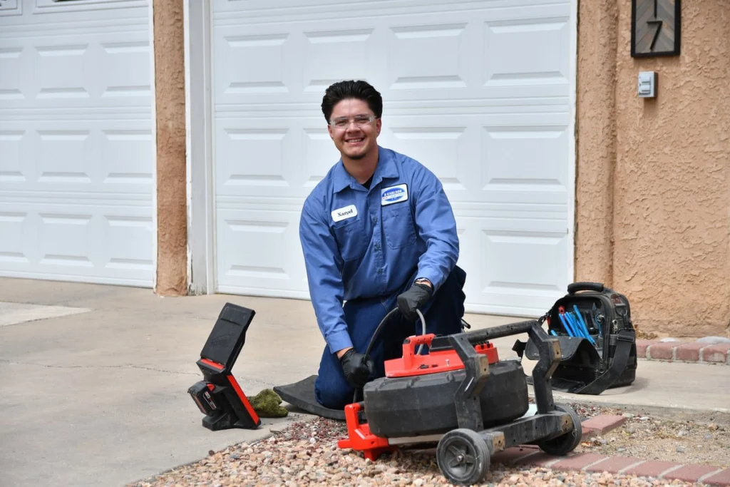 B. Carlson technician with inspection equipment during an HVAC tune-up