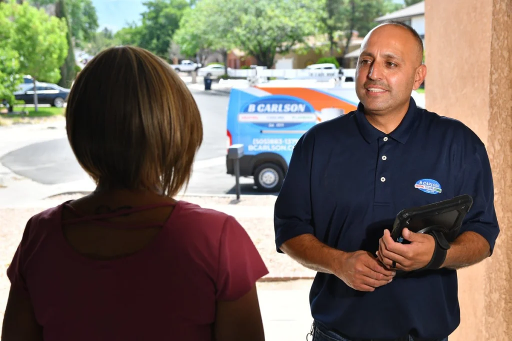 Service professional consulting with customer in Albuquerque, NM