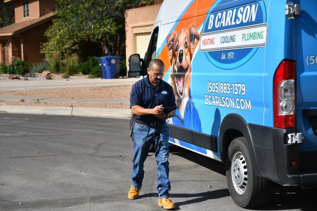 Service professional with HVAC plumbing van in Albuquerque, NM