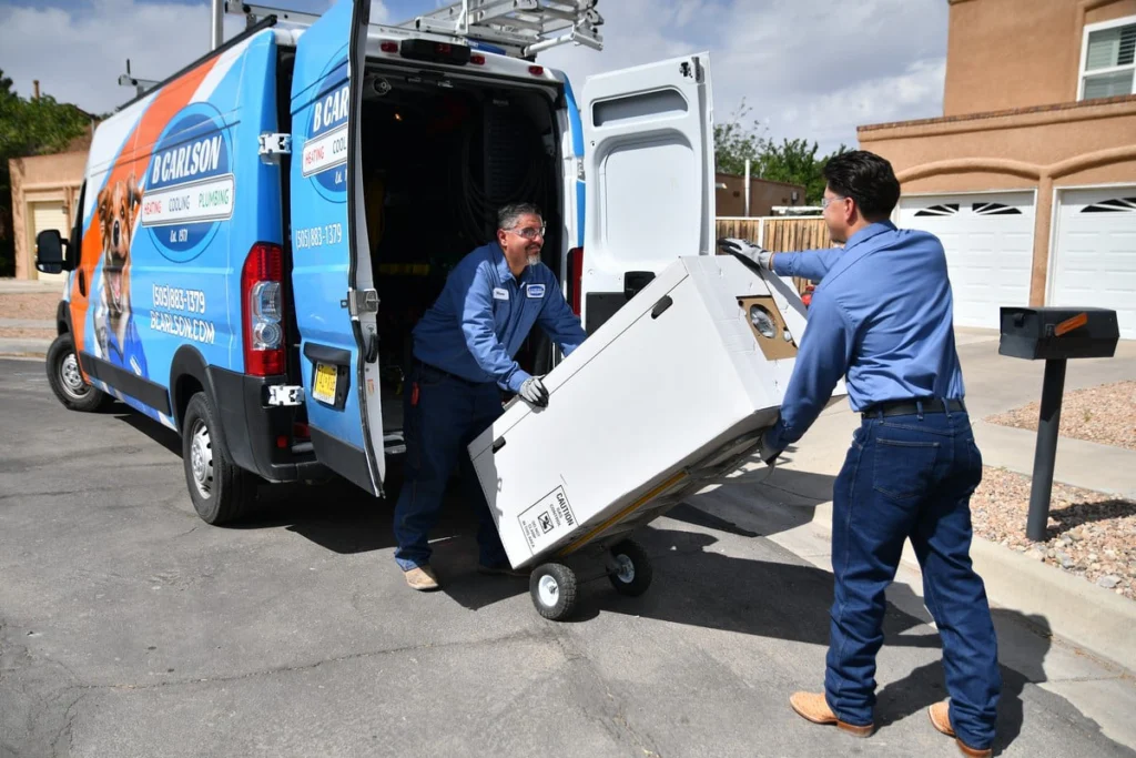 Service technicians unloading water heater in Albuquerque, NM