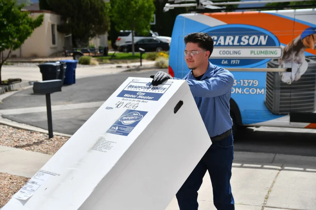 Technician delivering new water heater unit in Albuquerque, NM