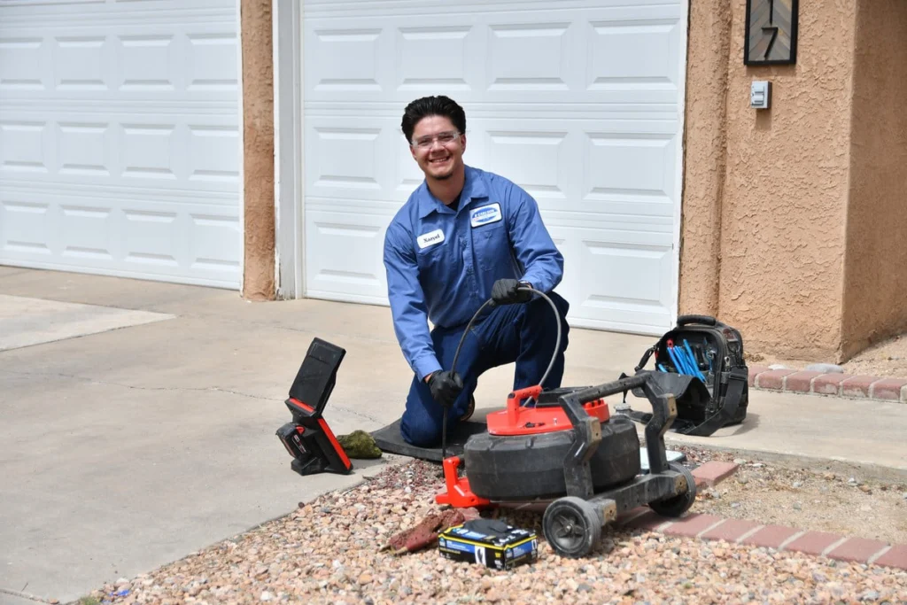 Technician with camera inspection equipment in Albuquerque, NM