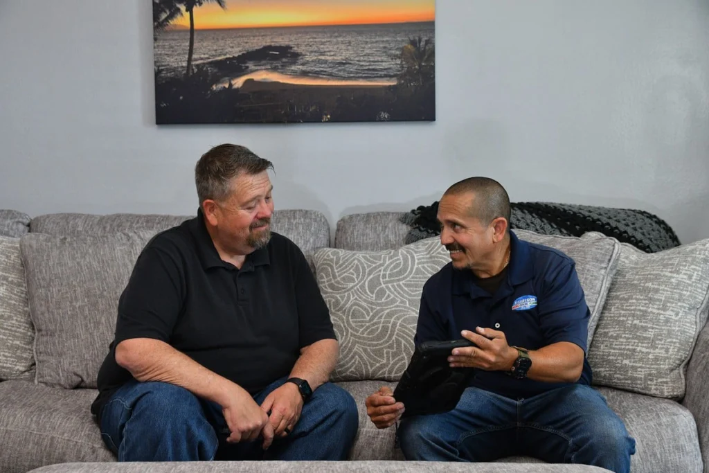 Two professionals consulting in living room in Albuquerque, NM