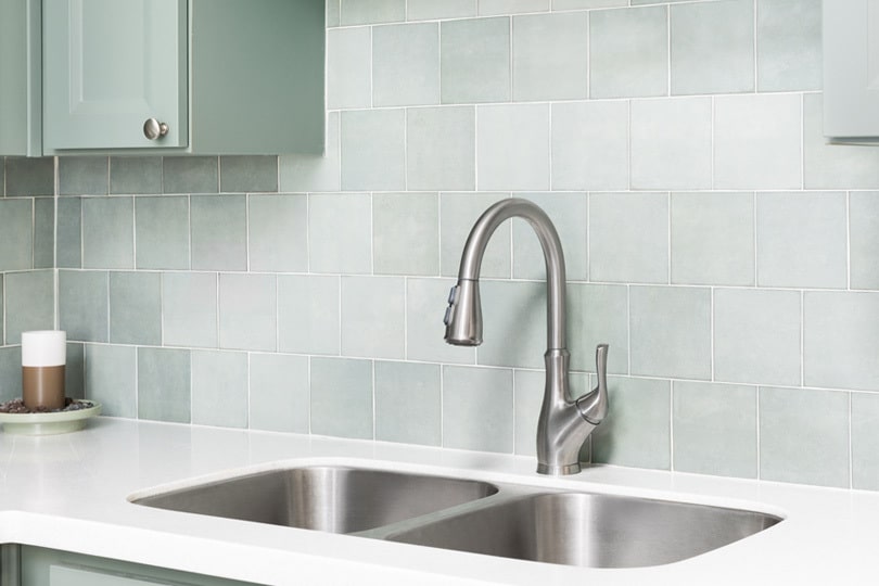 A modern looking kitchen with a sink.