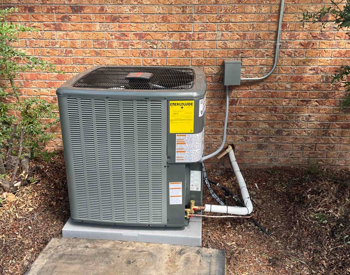 A newly installed HVAC Condenser outside the home