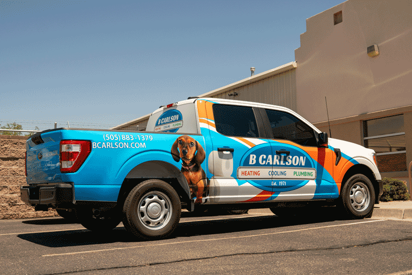The B. Carlson truck parked at the shop