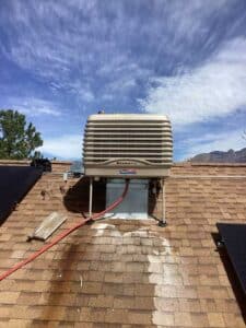 New Breezair evaporative cooler installed on rooftop in Albuquerque NM