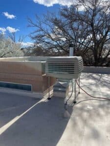 New Breezair evaporative cooler installed on rooftop in Albuquerque NM