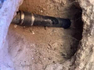 Repaired main sewer drain pipe exposed during root removal service in Bernalillo NM