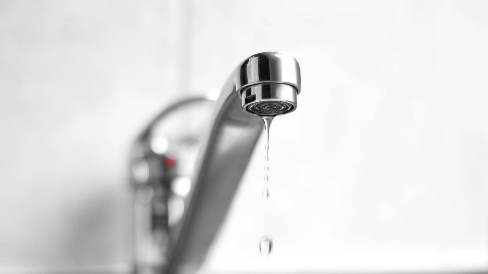 A bathroom faucet dripping