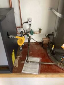 Gas line connection and shutoff valve installed for residential boiler system