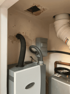 Whole-home humidifier connected to new furnace system in Santa Fe home