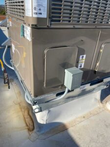Detailed image of an HVAC installation on a home's roof in NM