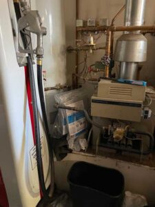 Water heater and furnace setup inside Albuquerque home during HVAC system evaluation