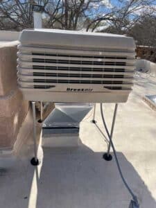 Close-up of Breezair evaporative cooler installed for Albuquerque home cooling system